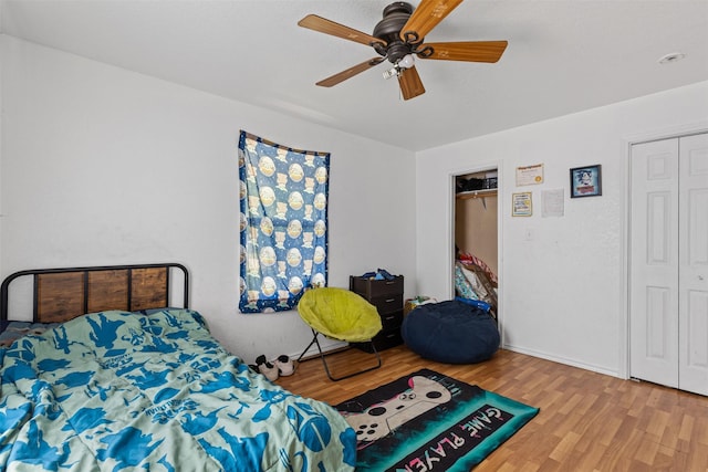 bedroom with wood finished floors and ceiling fan