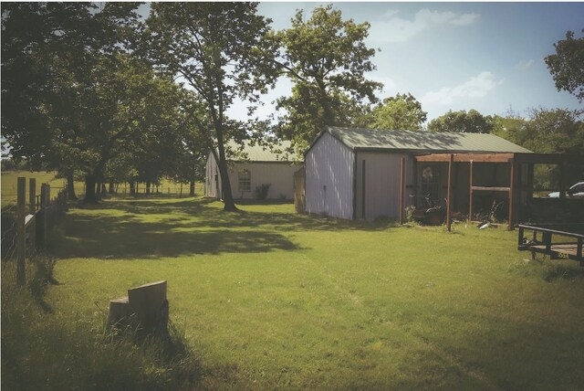 view of yard featuring an outbuilding and a pole building