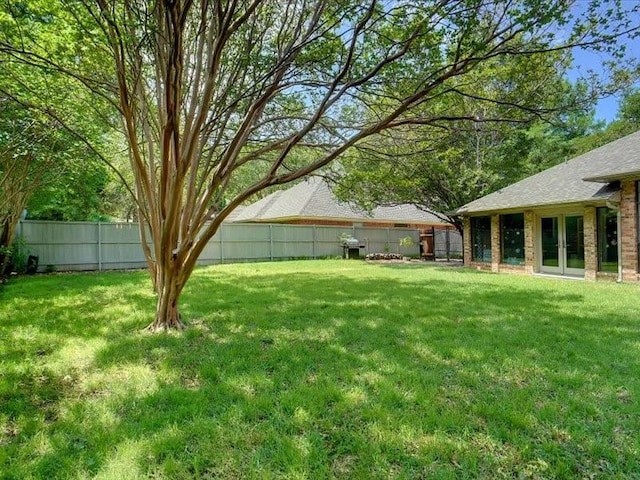 1428 Oxford Ln, Denton, TX 76209 - view of yard with french doors and a fenced backyard