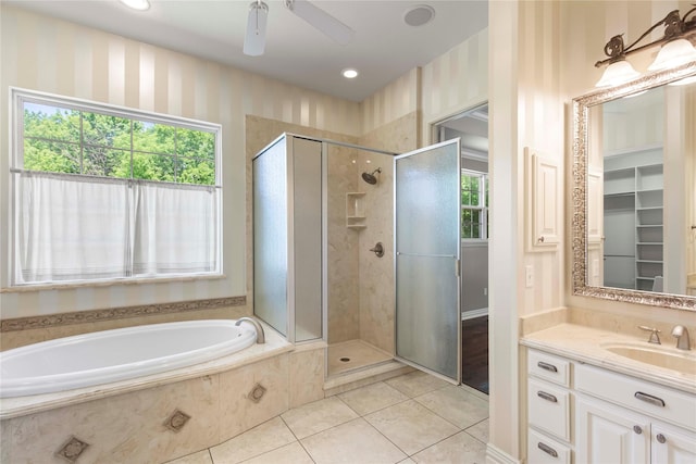 full bath featuring a shower stall, vanity, a bath, tile patterned floors, and a ceiling fan