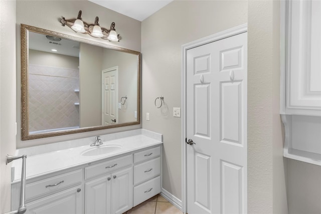 bathroom featuring tile patterned floors and vanity
