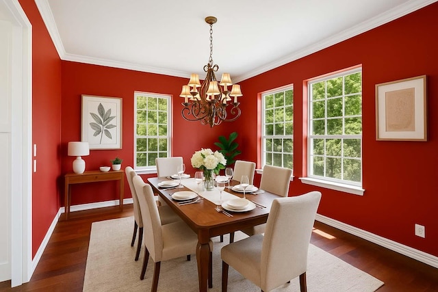 dining area featuring baseboards, a notable chandelier, and dark wood-type flooring