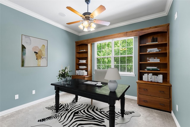 office featuring crown molding, a ceiling fan, light colored carpet, and baseboards