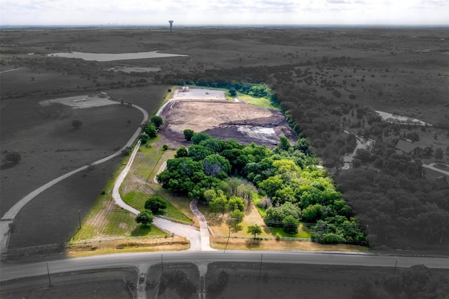 birds eye view of property with a rural view