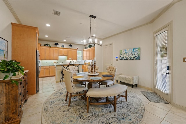 8405 Moore St, Frisco, TX 75034 - dining area with crown molding, light tile patterned flooring, a chandelier, recessed lighting, and visible vents