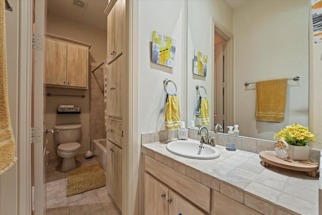 8405 Moore St, Frisco, TX 75034 - bathroom featuring visible vents, vanity, tile patterned floors, toilet, and bathing tub / shower combination