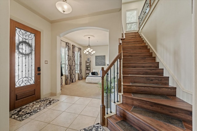 8405 Moore St, Frisco, TX 75034 - carpeted foyer entrance featuring arched walkways, stairs, and tile patterned floors