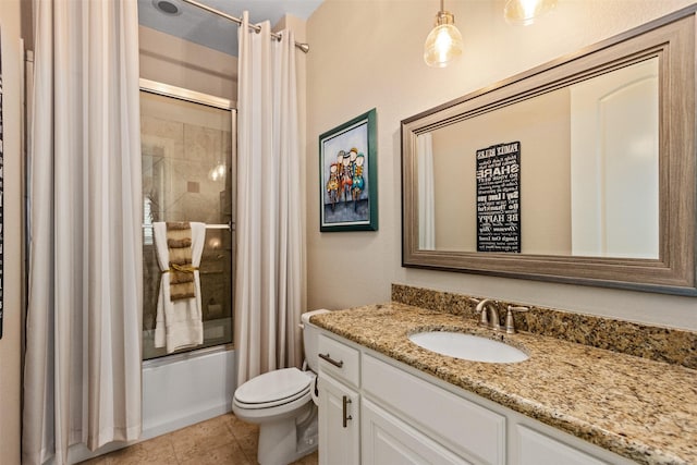 full bath featuring enclosed tub / shower combo, tile patterned floors, toilet, and vanity