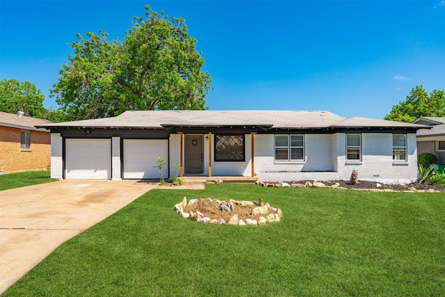 5409 Mallory Dr, Haltom City, TX 76117 - ranch-style house with a front lawn, driveway, an attached garage, and brick siding