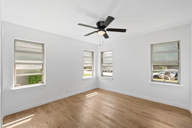 5409 Mallory Dr, Haltom City, TX 76117 - empty room featuring baseboards, a ceiling fan, and light wood-style flooring