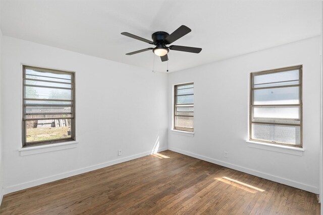 5409 Mallory Dr, Haltom City, TX 76117 - empty room featuring baseboards, wood finished floors, and ceiling fan
