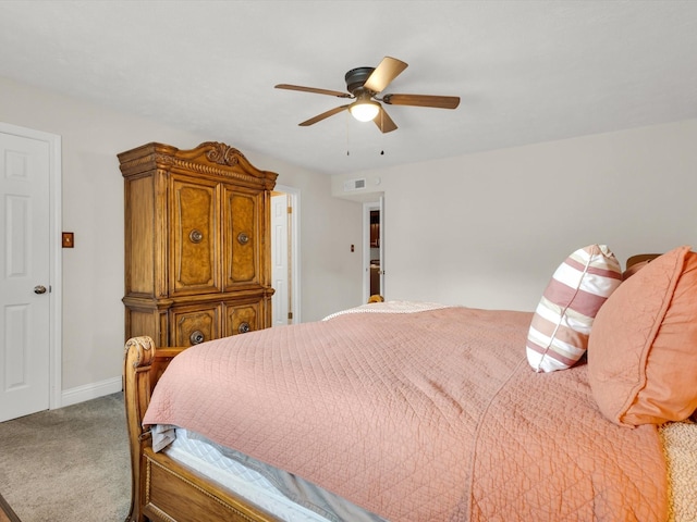 bedroom featuring baseboards, visible vents, ceiling fan, and carpet floors