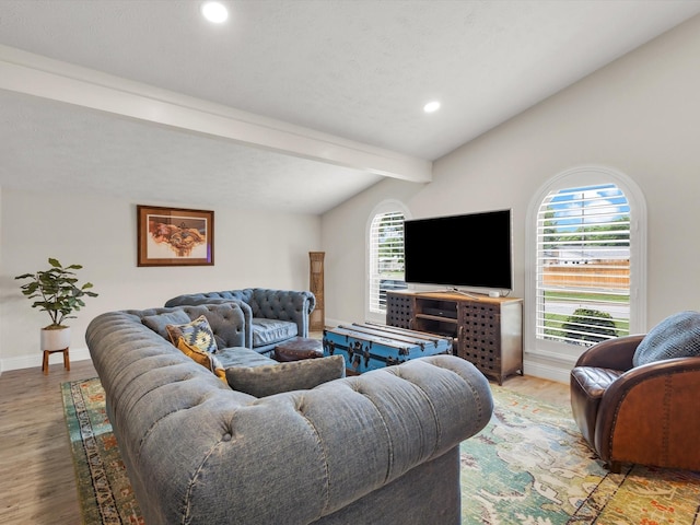 living area featuring baseboards, recessed lighting, wood finished floors, and lofted ceiling with beams