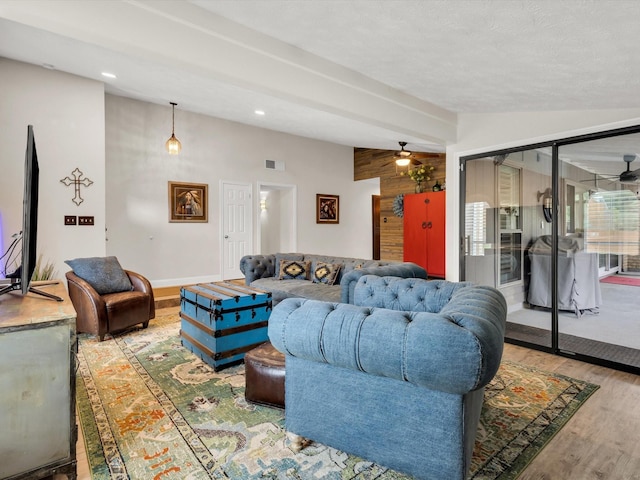 living room featuring baseboards, recessed lighting, wood finished floors, and a ceiling fan