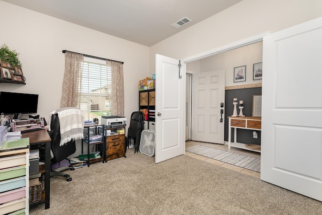 carpeted home office with visible vents