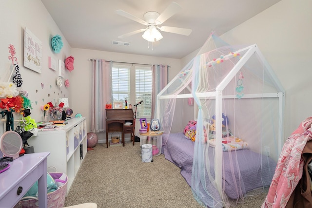 carpeted bedroom featuring visible vents and a ceiling fan