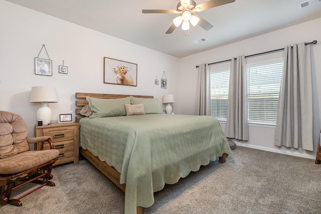carpeted bedroom with baseboards, visible vents, and ceiling fan