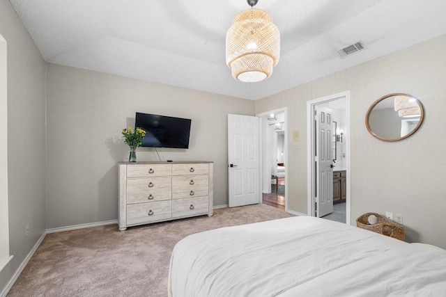 carpeted bedroom featuring visible vents and baseboards