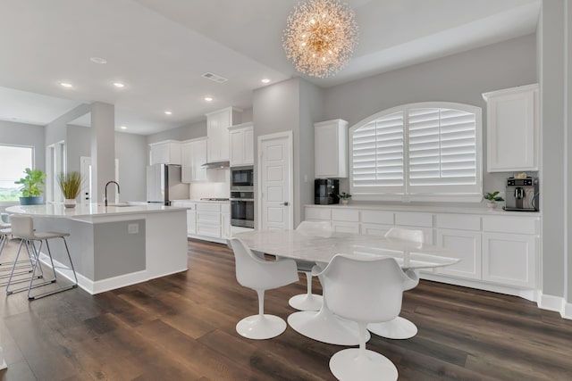 14316 Capridge Rd, Fort Worth, TX 76008 - dining room with dark wood finished floors and recessed lighting