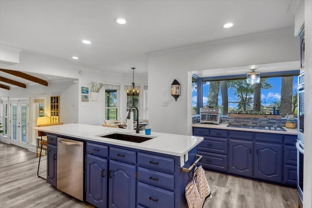 kitchen with black electric stovetop, a sink, blue cabinets, dishwasher, and light wood finished floors