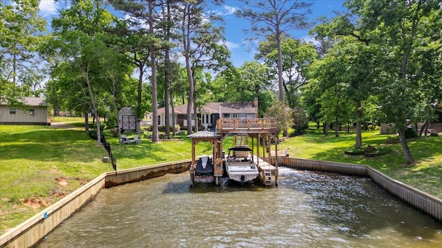 dock area with a deck with water view and a yard