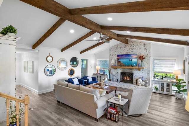 living area with a fireplace, wood finished floors, a ceiling fan, and recessed lighting