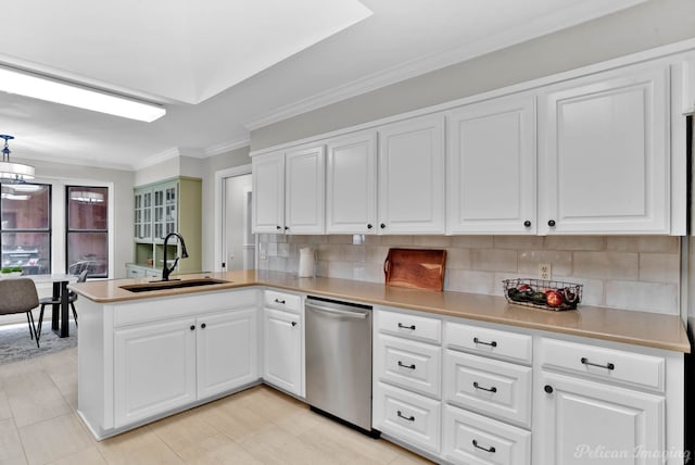 kitchen with dishwasher, a sink, a peninsula, tasteful backsplash, and white cabinets