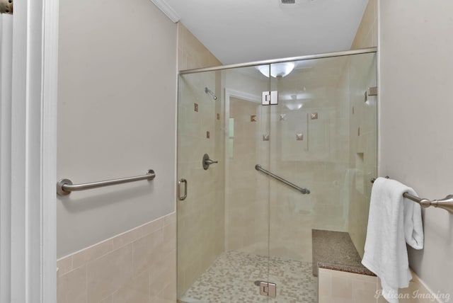 bathroom with a shower stall