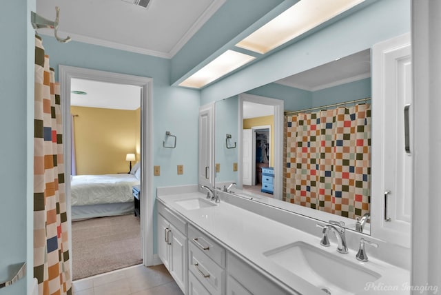 bathroom featuring ornamental molding, tile patterned floors, double vanity, and connected bathroom