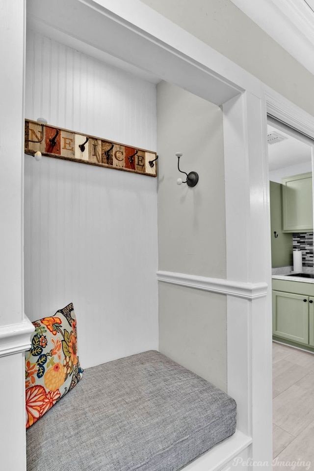 mudroom with a sink