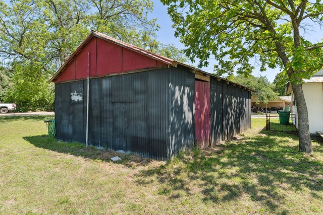 view of pole building with a lawn