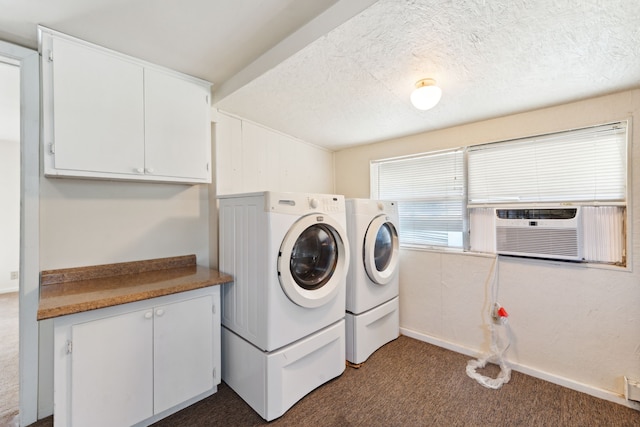 laundry area featuring cabinet space, separate washer and dryer, cooling unit, dark carpet, and a textured ceiling
