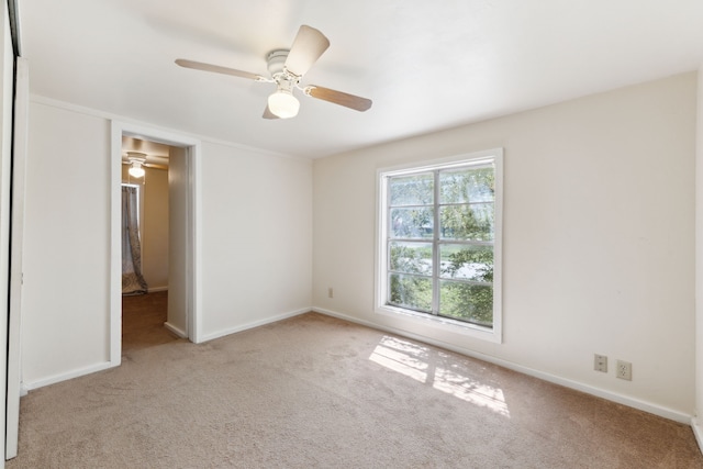 unfurnished bedroom featuring ceiling fan, carpet floors, and baseboards