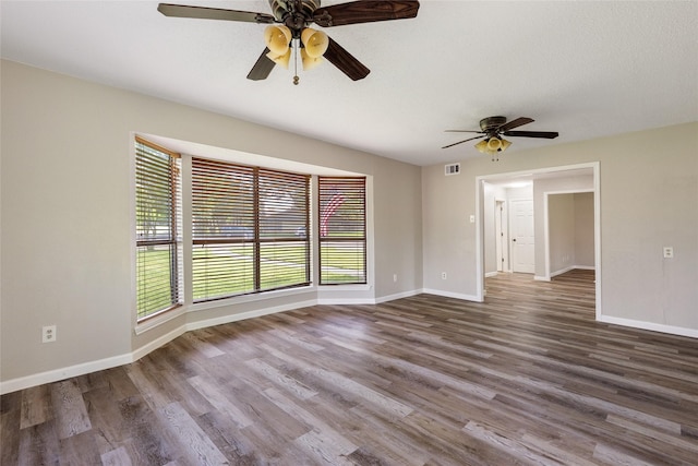 2820 Bois D Arc St, Commerce, TX 75428 - empty room with a ceiling fan, baseboards, and wood finished floors
