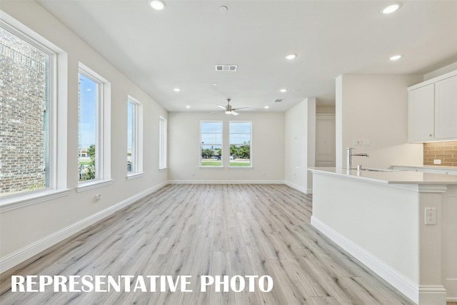kitchen featuring visible vents, light wood-type flooring, and recessed lighting