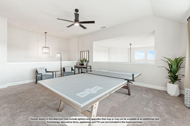 game room featuring carpet, visible vents, baseboards, and ceiling fan with notable chandelier