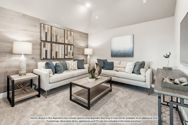 living room featuring lofted ceiling, carpet flooring, and baseboards