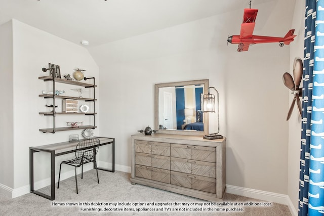 home office featuring carpet flooring, vaulted ceiling, and baseboards