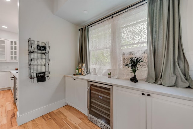123 S Rosemont Ave, Dallas, TX 75208 - indoor bar with wine cooler, light wood-type flooring, recessed lighting, baseboards, and tasteful backsplash