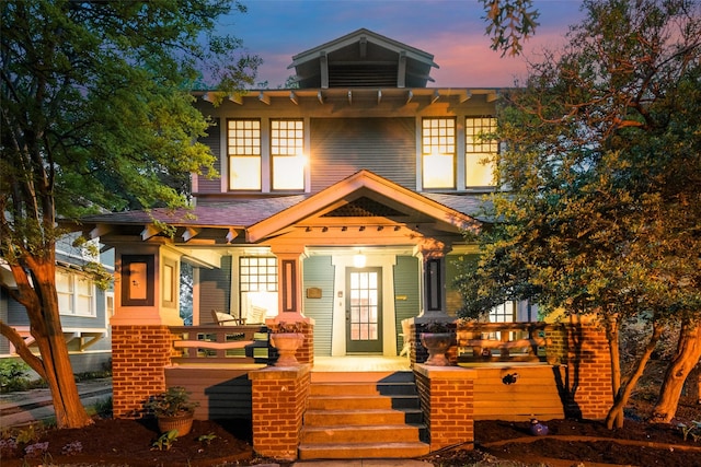 123 S Rosemont Ave, Dallas, TX 75208 - back of property at dusk with covered porch