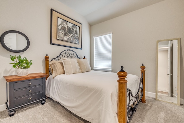 bedroom with baseboards, carpet flooring, and vaulted ceiling