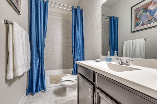 bathroom featuring baseboards, toilet, shower / bath combination with curtain, tile patterned floors, and vanity