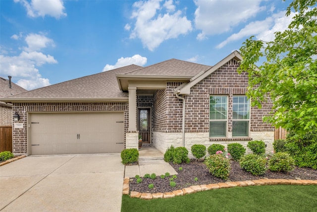 single story home with brick siding, a shingled roof, driveway, and an attached garage