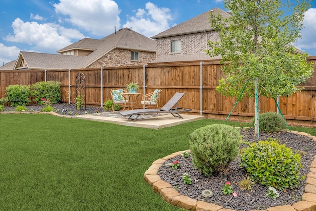 view of yard with a patio and a fenced backyard