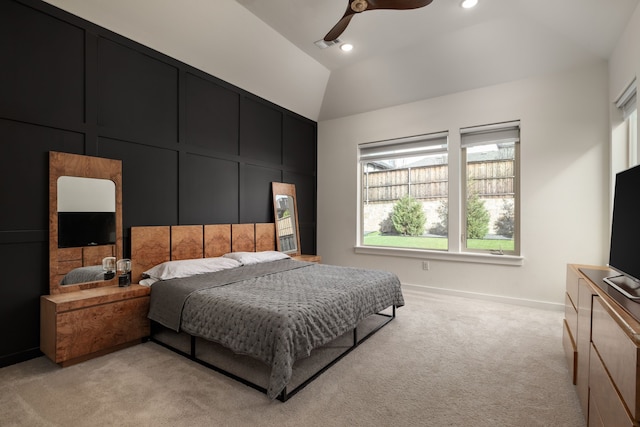 bedroom featuring baseboards, light carpet, multiple windows, and lofted ceiling