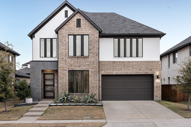 view of front facade featuring stucco siding, fence, and concrete driveway