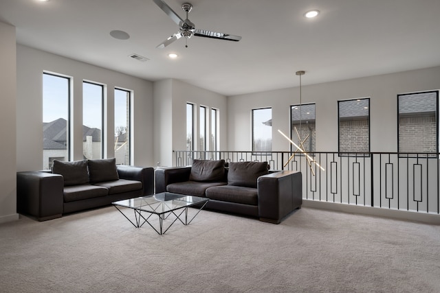 living room featuring ceiling fan, recessed lighting, visible vents, and carpet floors