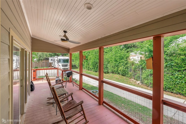 deck featuring a fenced backyard and ceiling fan