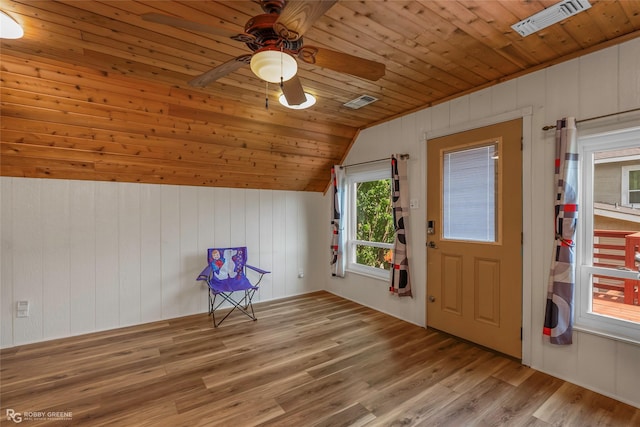 additional living space with visible vents, a ceiling fan, wood finished floors, vaulted ceiling, and wood ceiling