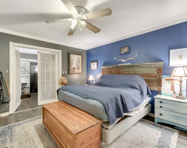 bedroom featuring baseboards, ornamental molding, a ceiling fan, and wood finished floors